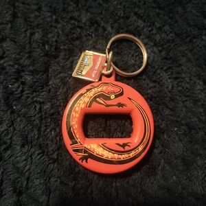 vintage Marlboro Adventure Team lizard-themed bottle opener keychain. 